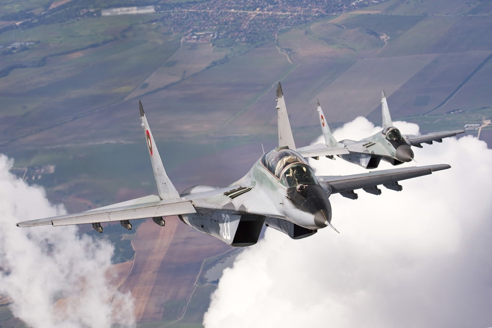 Bulgarian and Polish Air Force MiG-29s planes flying over Bulgaria Canvas Art - Daniele FaccioliStocktrek Images (17 x 12)