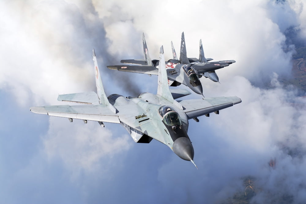 Bulgarian and Polish Air Force MiG-29s planes flying over Bulgaria Canvas Art - Daniele FaccioliStocktrek Images (17 x 12)