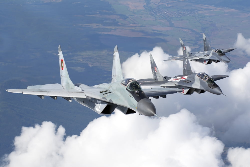 Bulgarian and Polish Air Force MiG-29s planes flying over Bulgaria Canvas Art - Daniele FaccioliStocktrek Images (17 x 12)