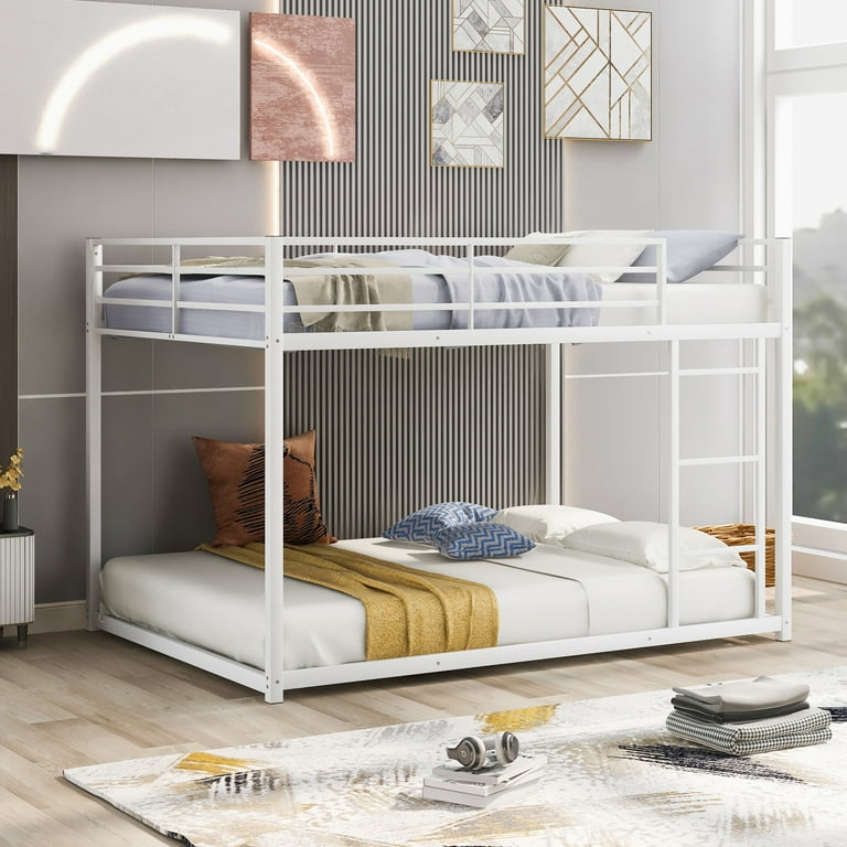 White bunk beds with mattresses top