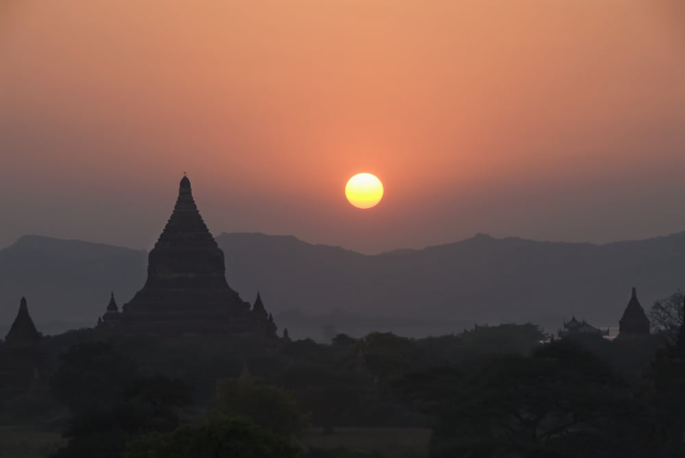 Burma (Myanmar) Bagan Silhouetted temples and sunball at sunset Canvas Art - Richard Maschmeyer Design Pics (38 x 26)