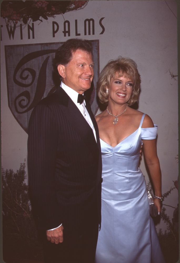 Burt Sugarman In Tuxedo And Mary Hart In Light Blue Off Shoulder Gown