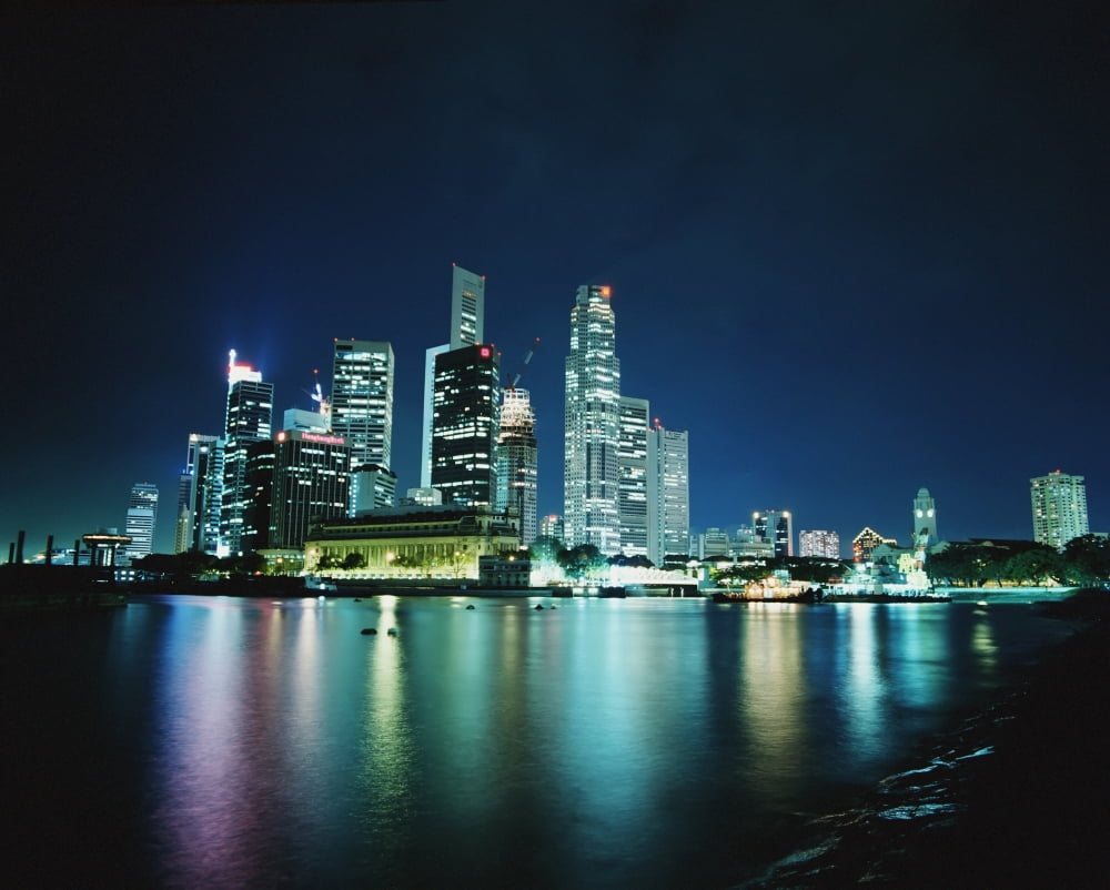 Business District Skyline At Night With Reflections In Water Canvas Art - Martin Stolworthy Design Pics (17 x 13)