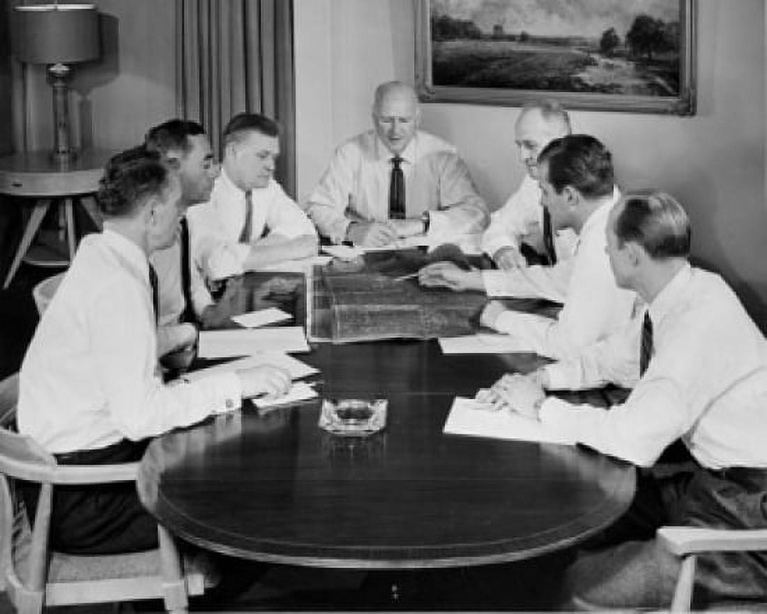 Business executives looking at blueprint in conference room Canvas Art - (18 x 24)