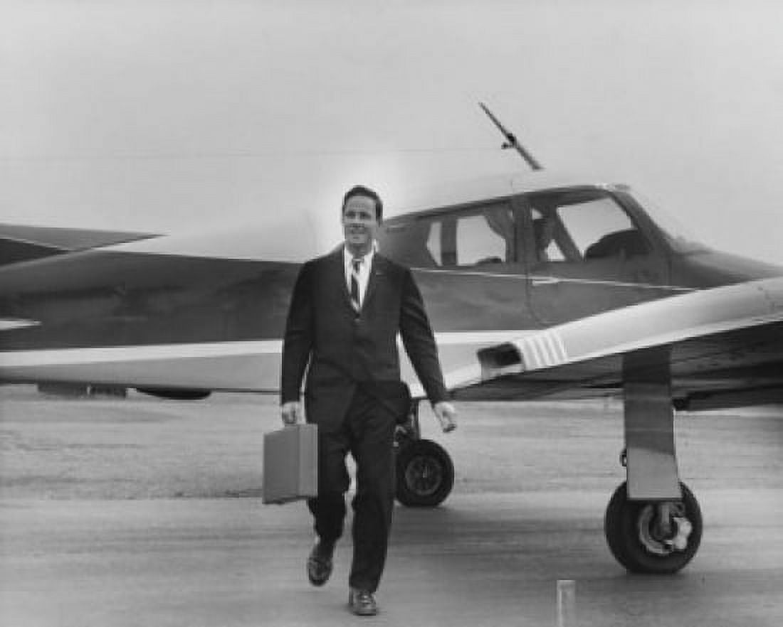 Business walking from an airplane with a briefcase Canvas Art - (18 x 24)