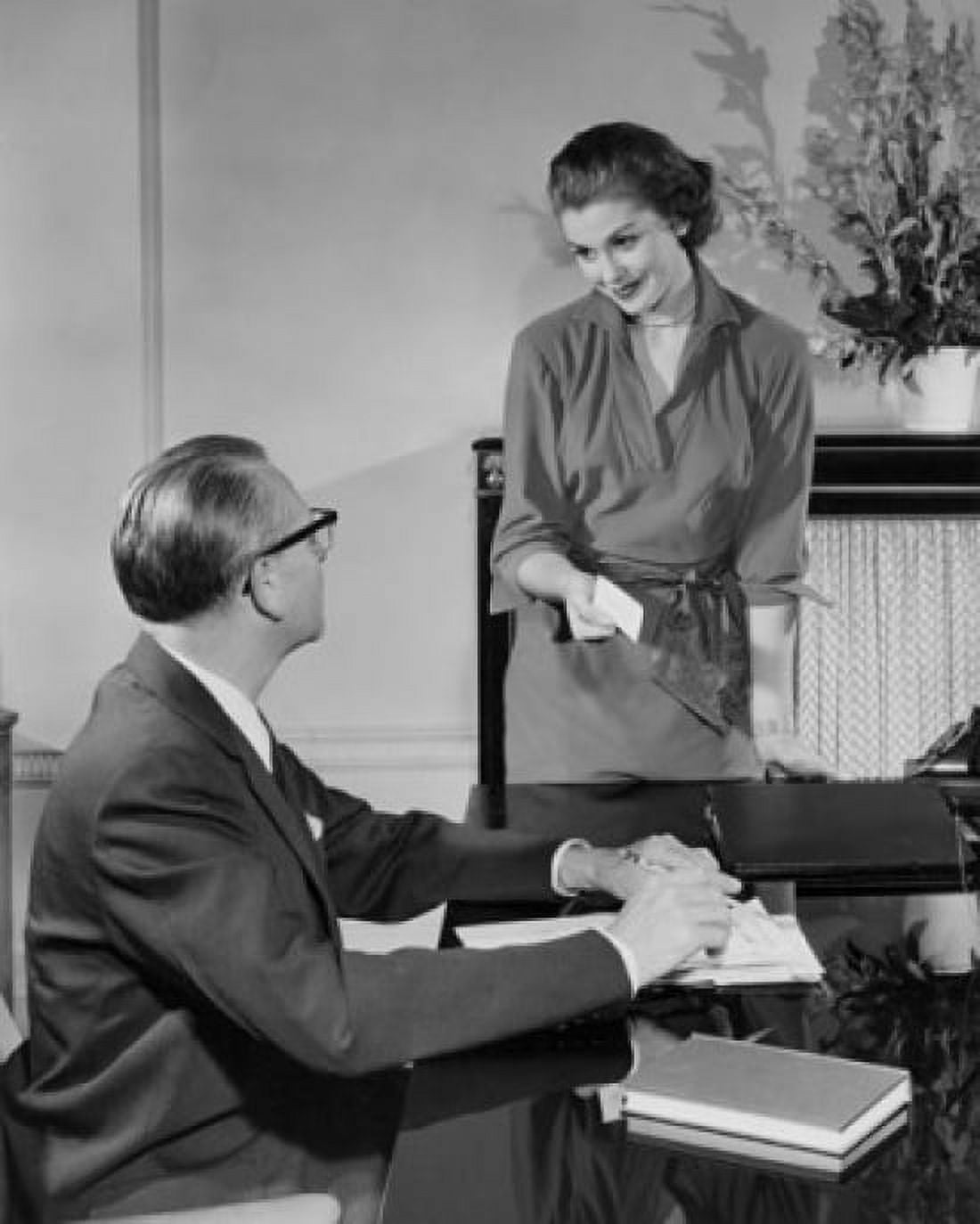 Businessman and a businesswoman talking in an office Canvas Art - (18 x 24)
