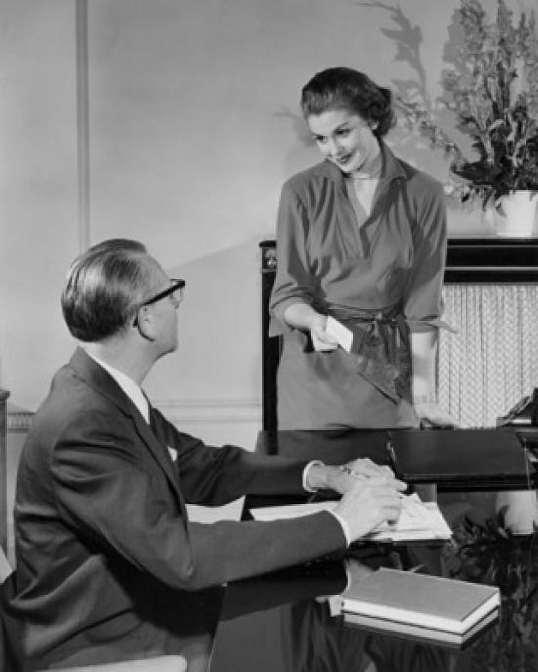 Businessman and a businesswoman talking in an office Canvas Art - (24 x 36)