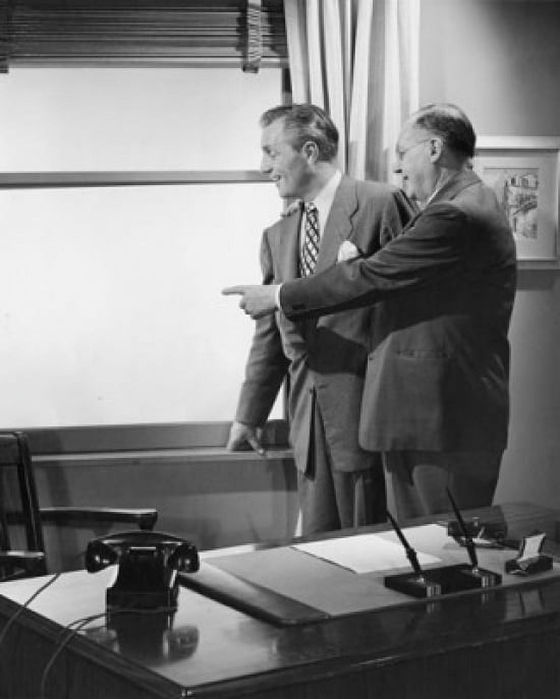 Businessman and farmer looking through window Canvas Art - (18 x 24)