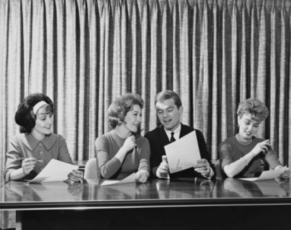 Businessman and three businesswomen sitting at a table Canvas Art - (18 x 24)