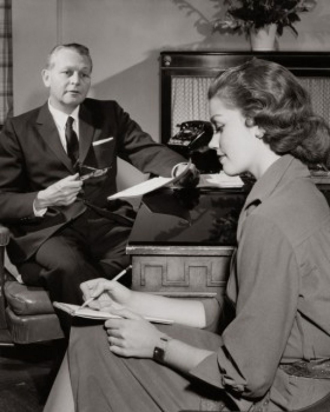 Businessman dictating a letter to his secretary in an office Canvas Art - (18 x 24)