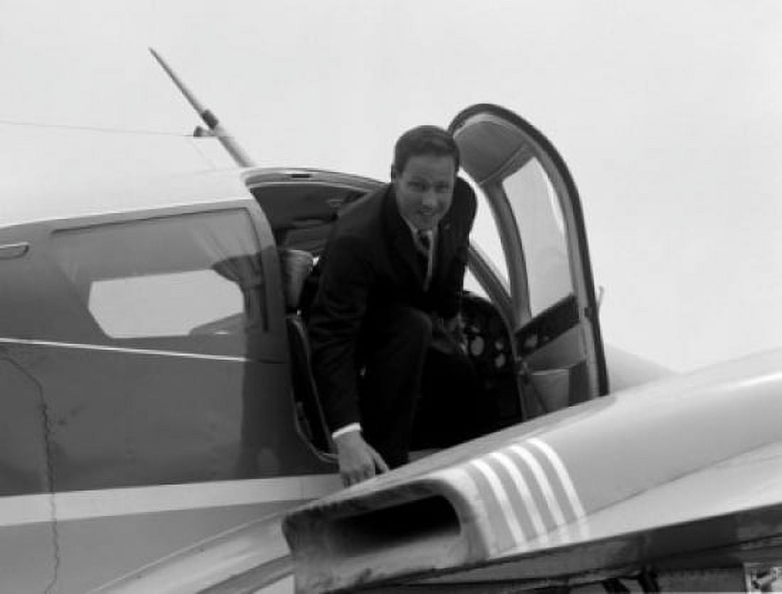 Businessman disembarking airplane Canvas Art - (18 x 24)