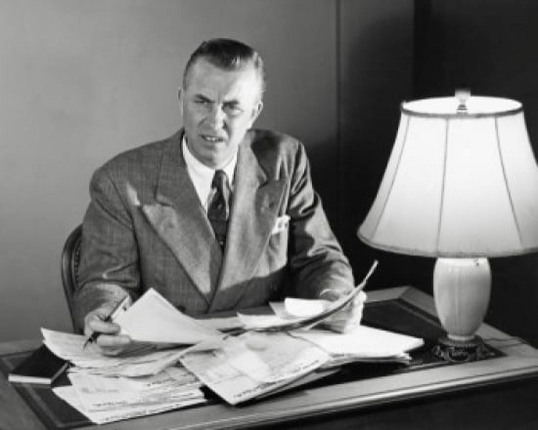 Businessman doing paperwork in an office Canvas Art - (24 x 36)
