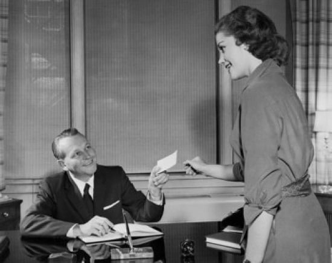 Businessman giving a check to his secretary in an office Canvas Art - (18 x 24)