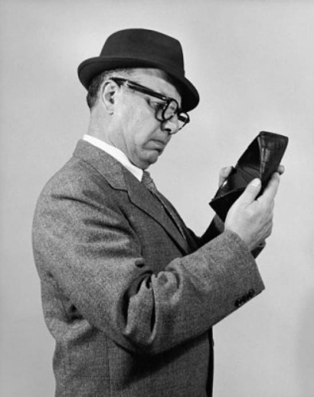 Businessman looking in his empty wallet Canvas Art - (24 x 36)