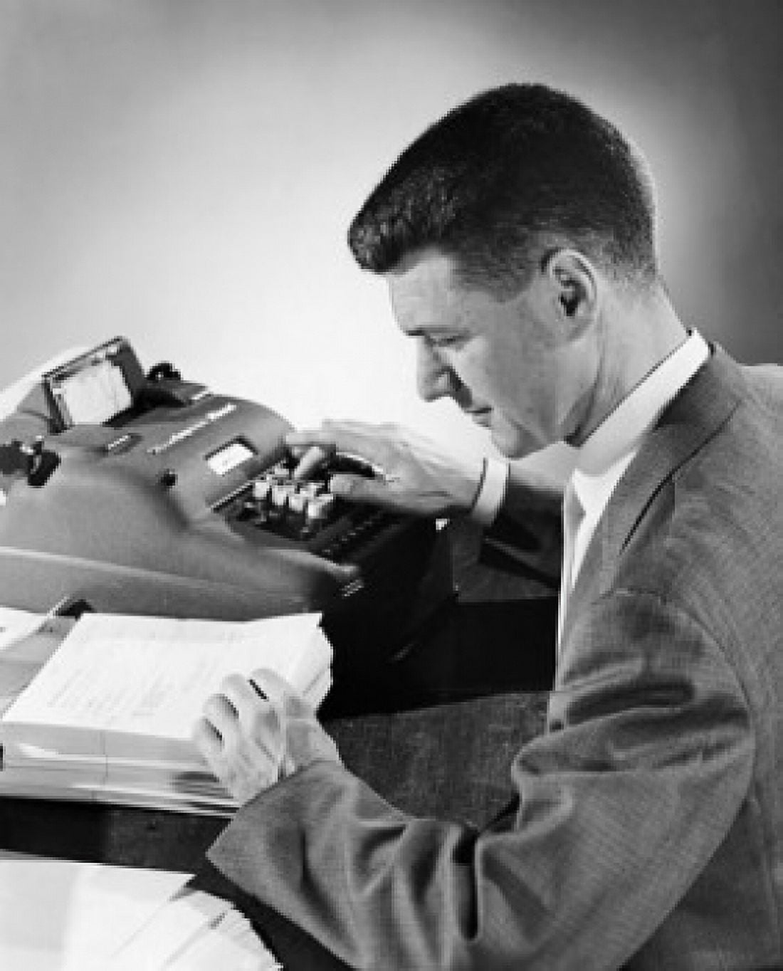 Businessman operating an adding machine Canvas Art - (18 x 24)
