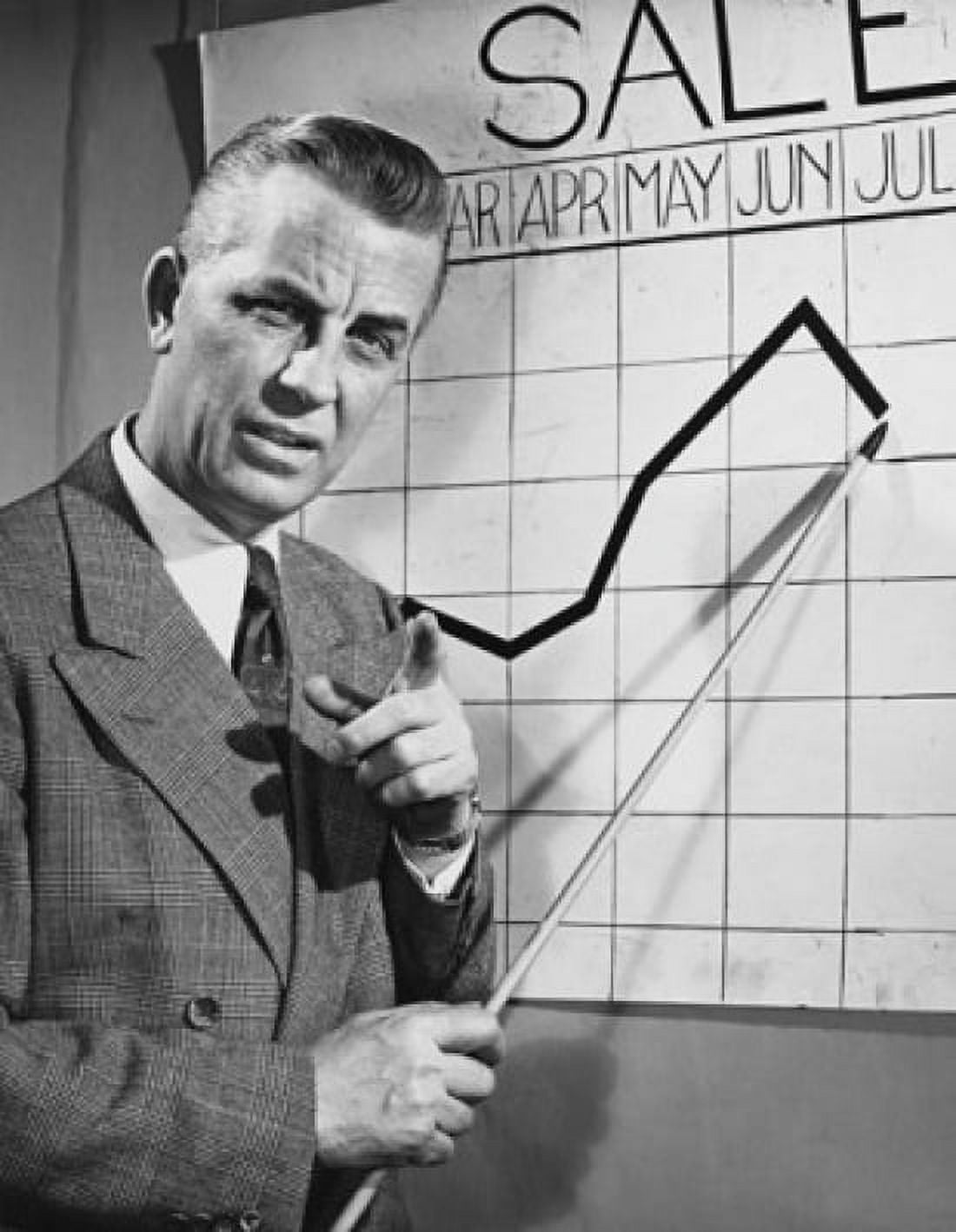 Businessman pointing at a line graph during a presentation Canvas Art - (24 x 36)