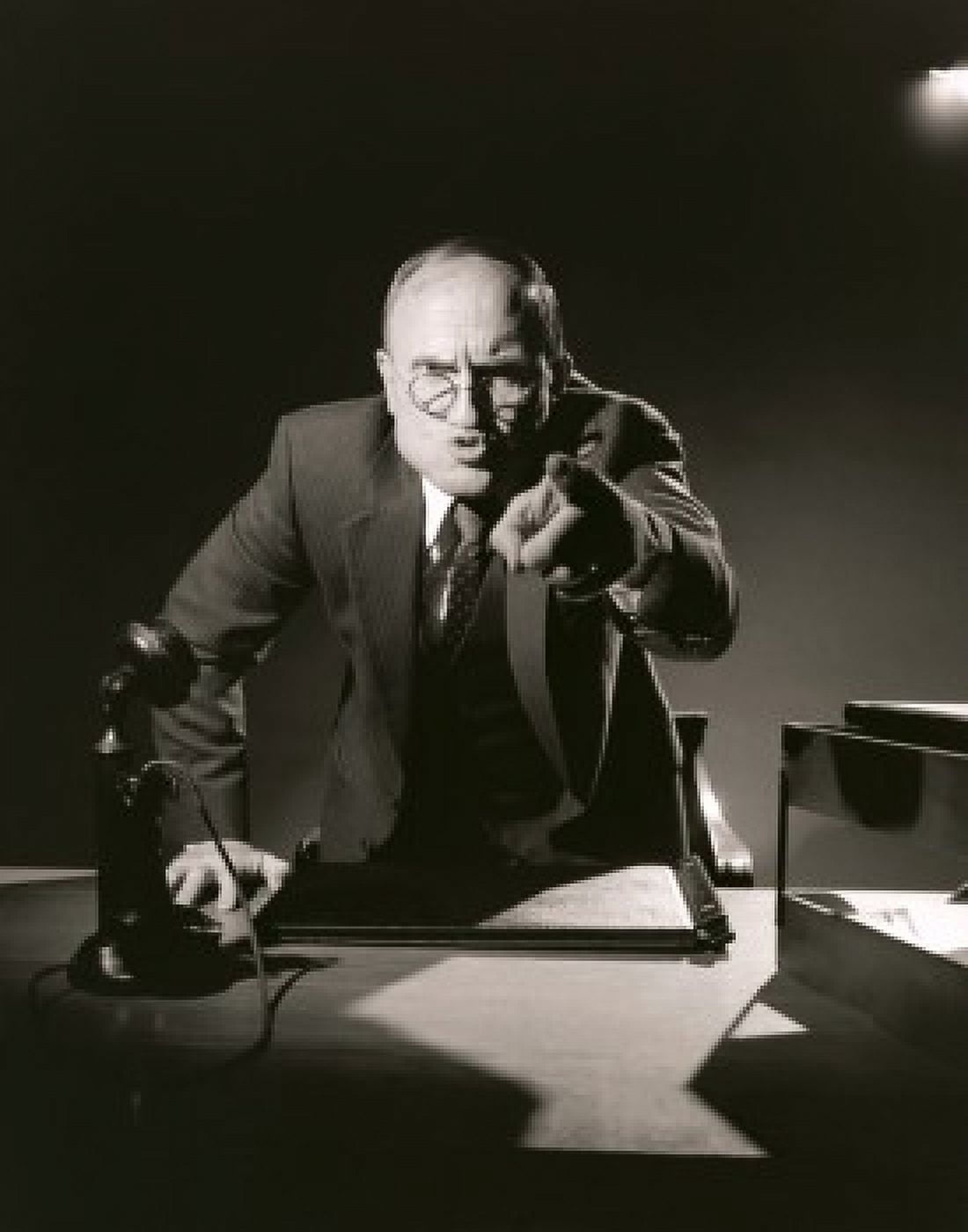 Businessman pointing to camera in office Canvas Art - (18 x 24)