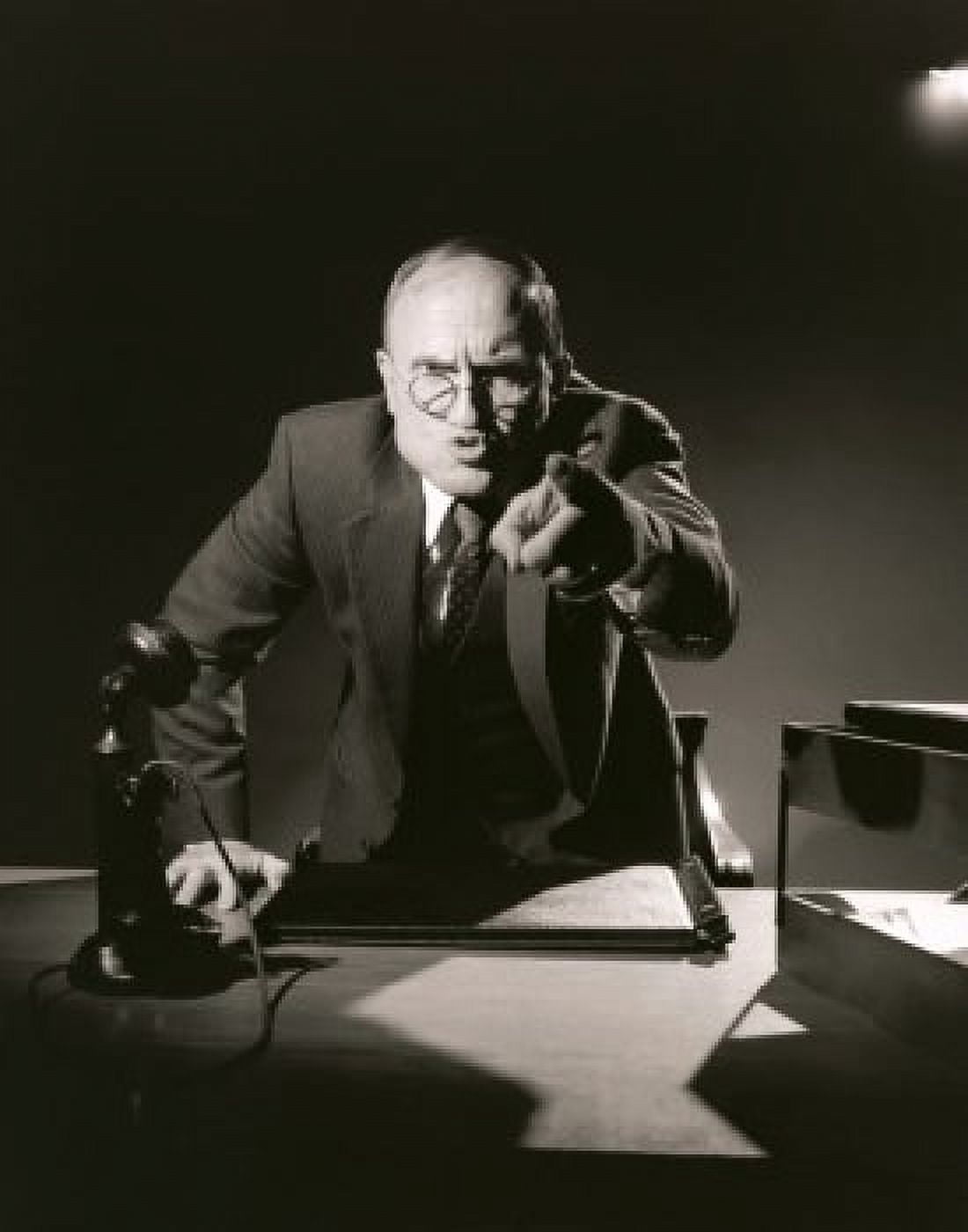 Businessman pointing to camera in office Canvas Art - (24 x 36)