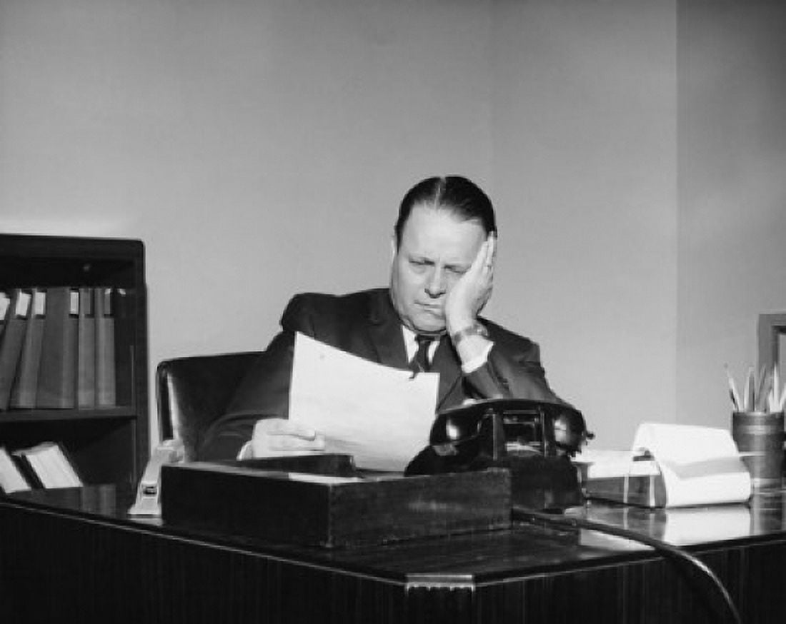 Businessman reading a document in an office Canvas Art - (18 x 24)