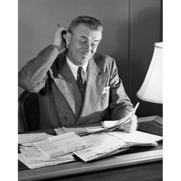 Businessman reading documents in an office Canvas Art - (18 x 24)