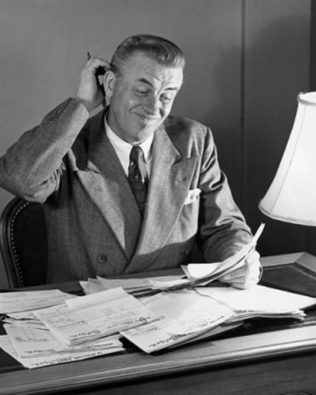 Businessman reading documents in an office Canvas Art - (24 x 36)