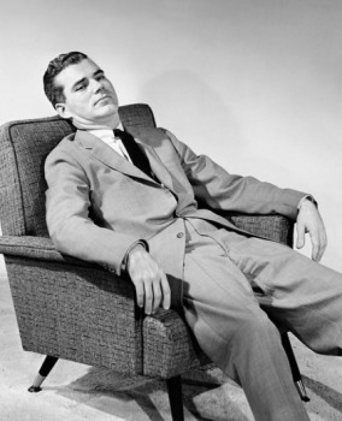 Businessman reclining in an armchair Canvas Art - (24 x 36)
