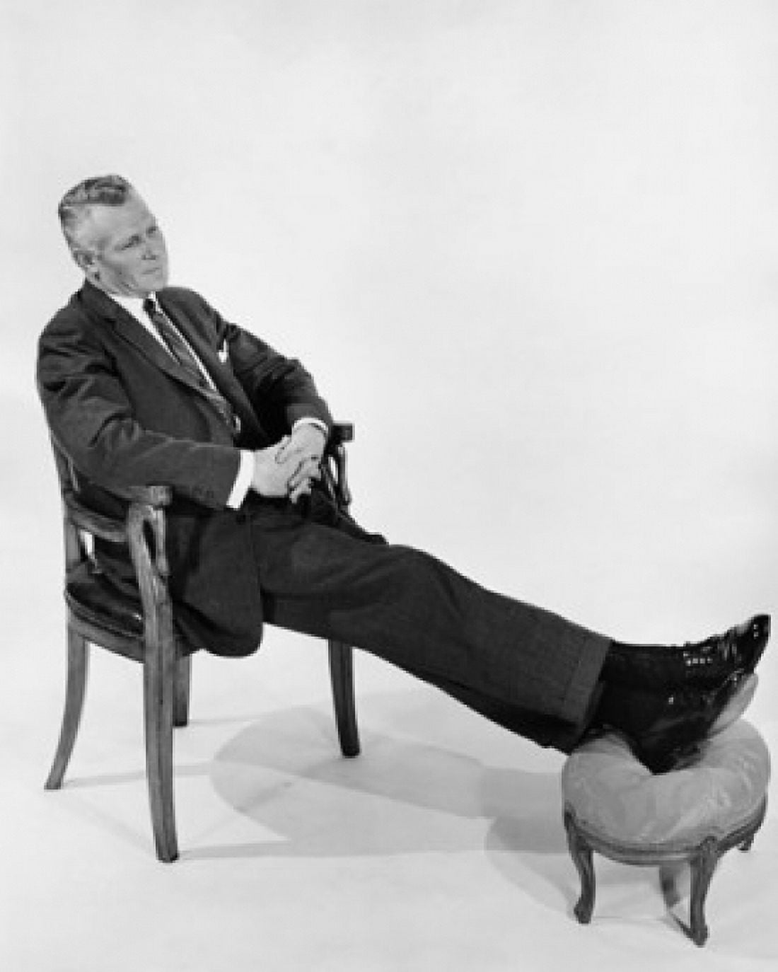 Businessman relaxing in chair Canvas Art - (24 x 36)