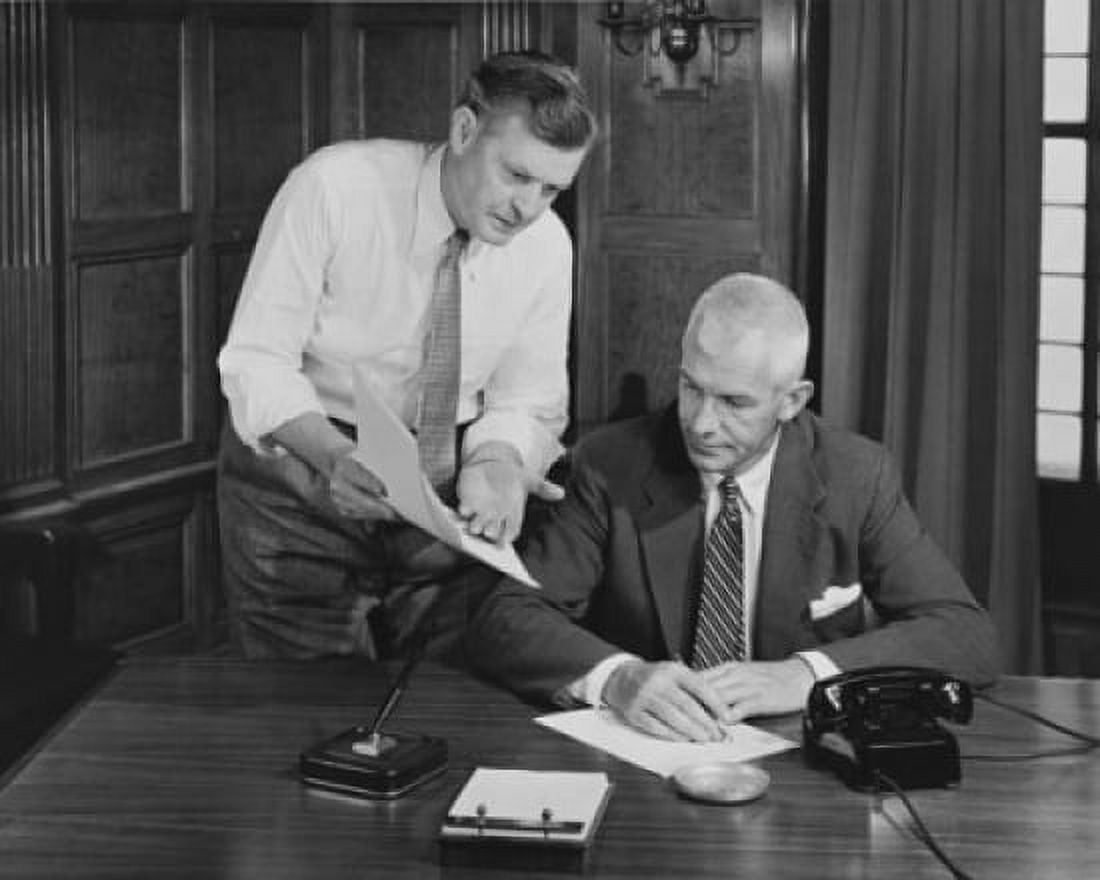 Businessman showing a document to another businessman Canvas Art - (18 x 24)