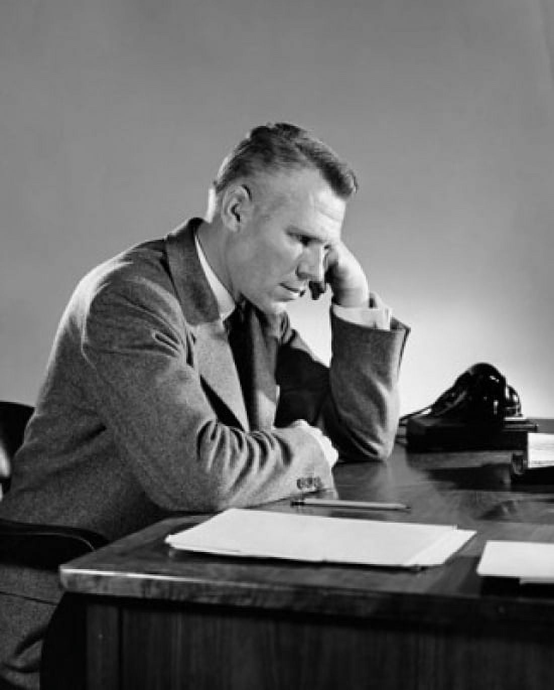 Businessman sitting at a desk and thinking Canvas Art - (18 x 24)