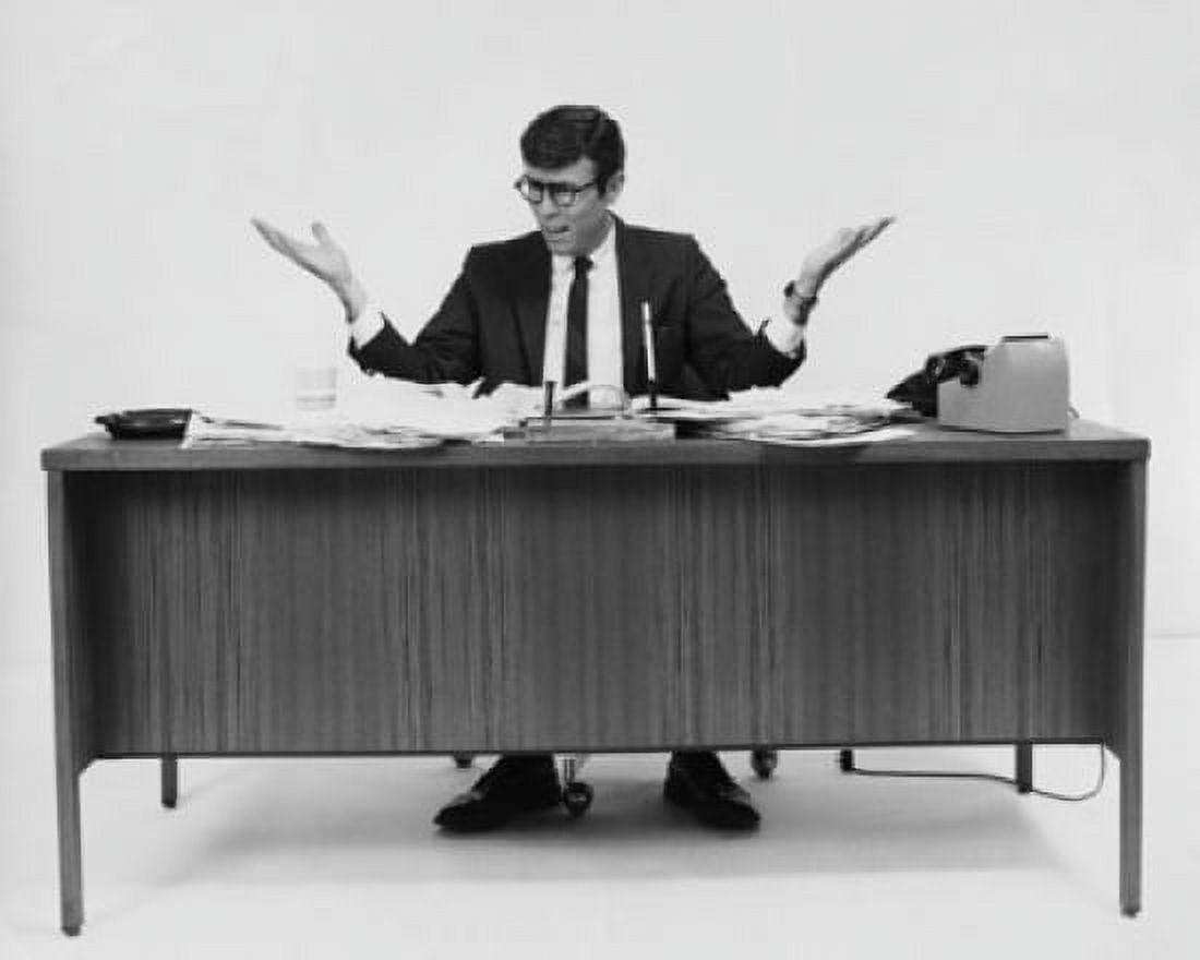 Businessman sitting at a desk in an office Canvas Art - (24 x 36)