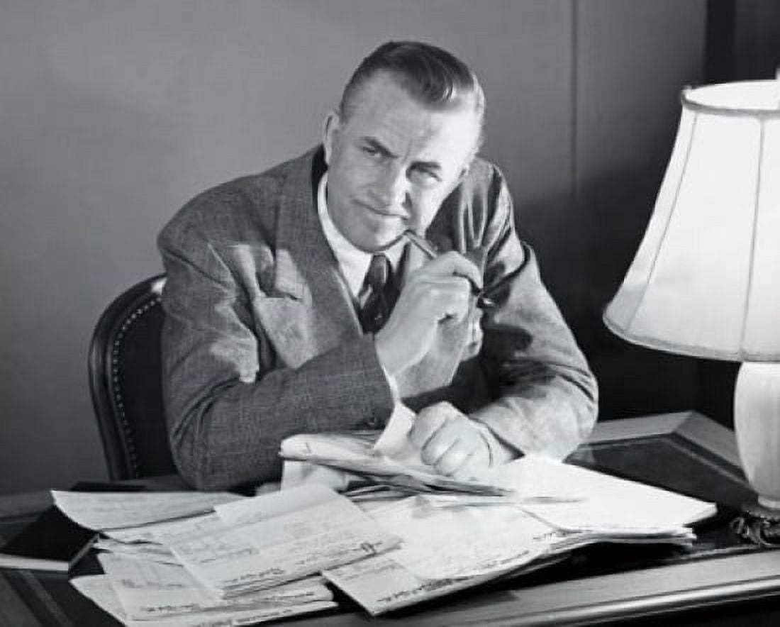 Businessman sitting at a desk in an office and thinking Canvas Art - (24 x 36)