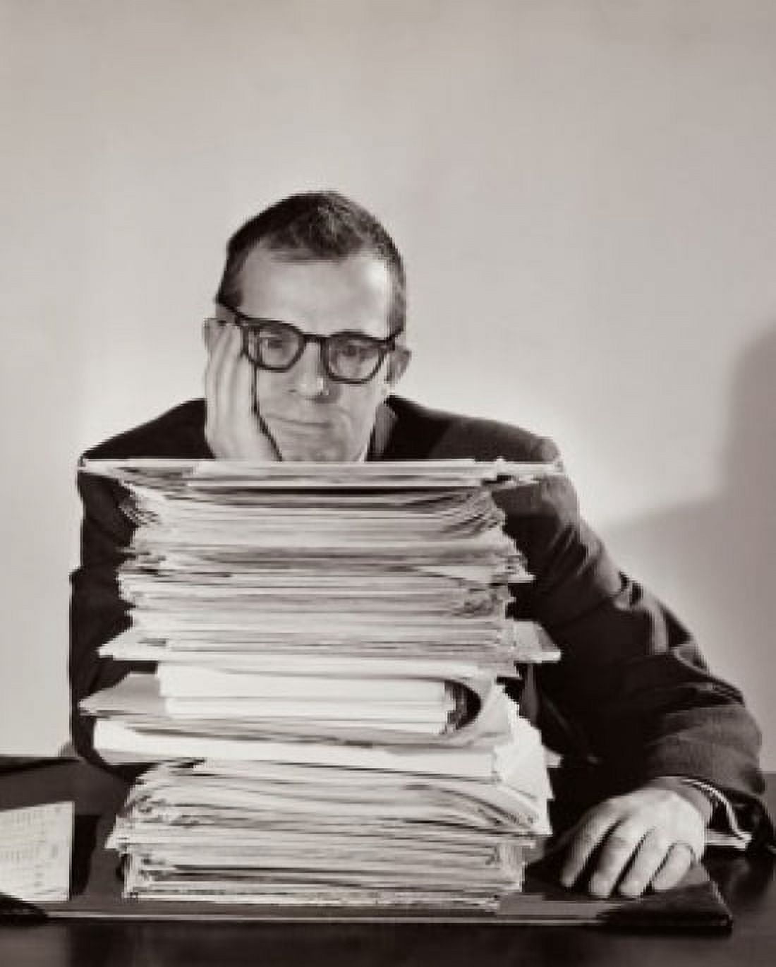 Businessman sitting behind a stack of file Canvas Art - (18 x 24)