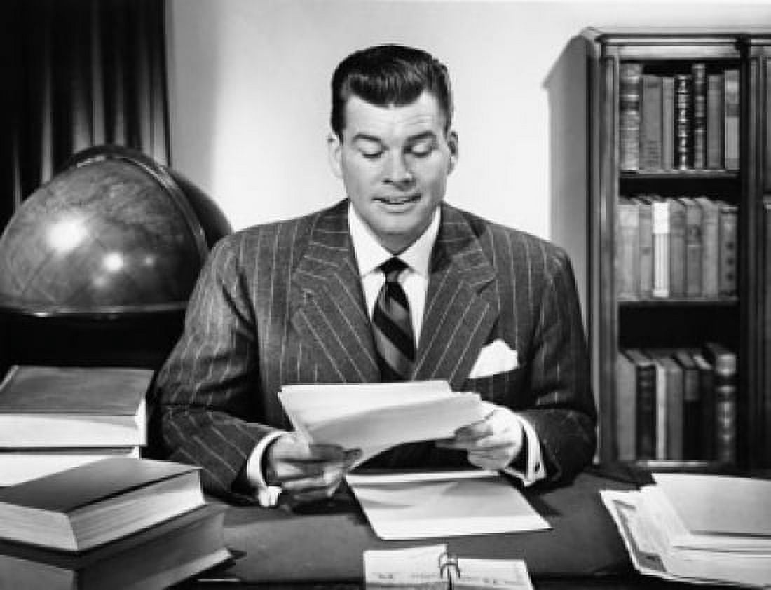 Businessman sitting in an office and reading documents Canvas Art - (18 x 24)
