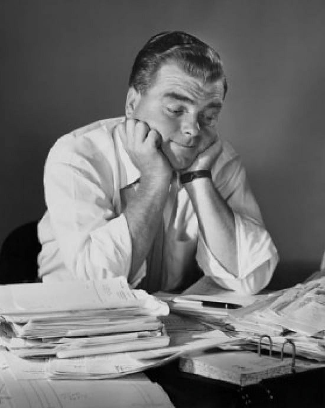 Businessman sitting in an office with his hands on his chin Canvas Art - (18 x 24)