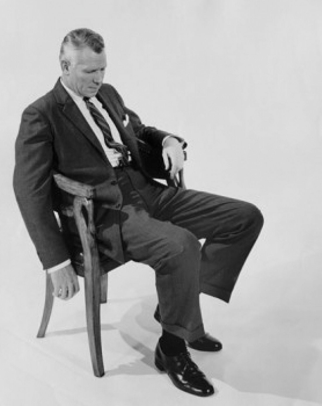 Businessman sitting on a chair Canvas Art - (24 x 36)