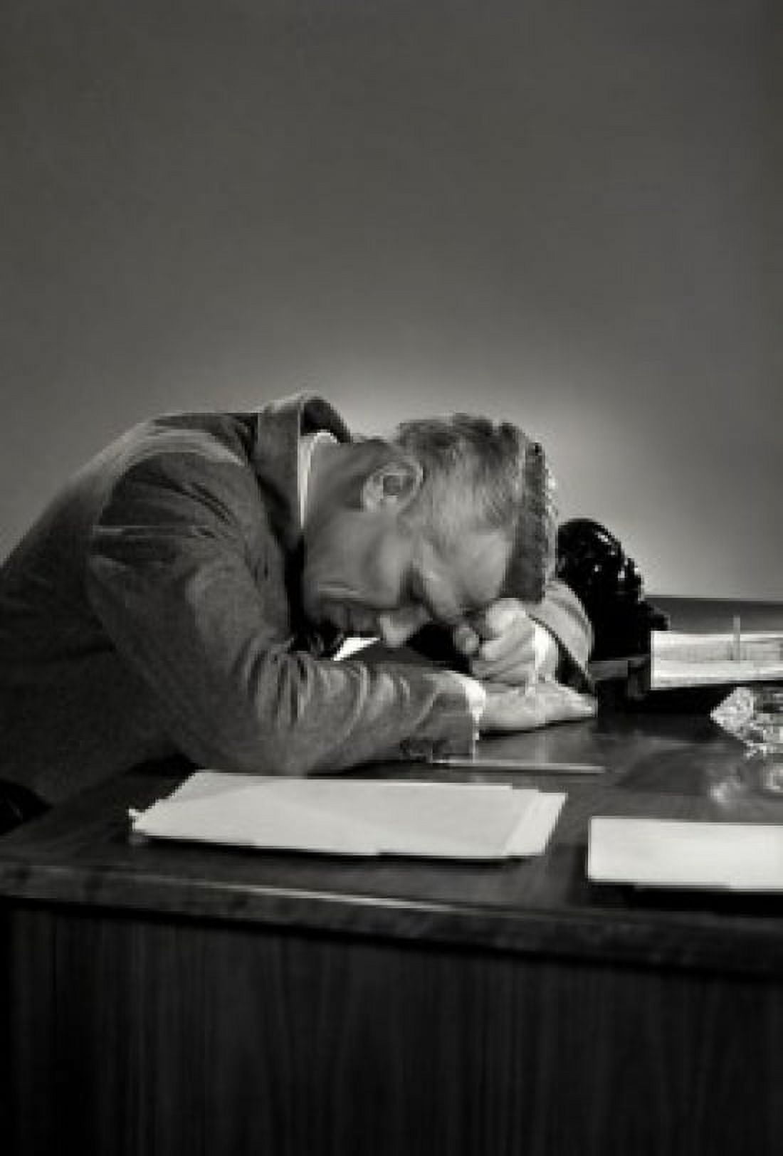 Businessman sleeping on desk in office Canvas Art - (24 x 36)