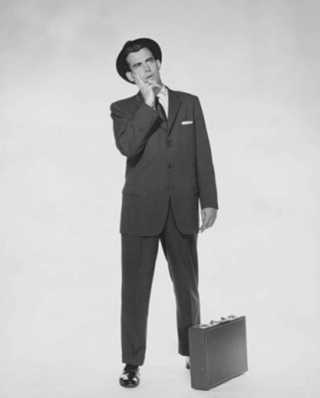 Businessman standing with a briefcase Canvas Art - (18 x 24)