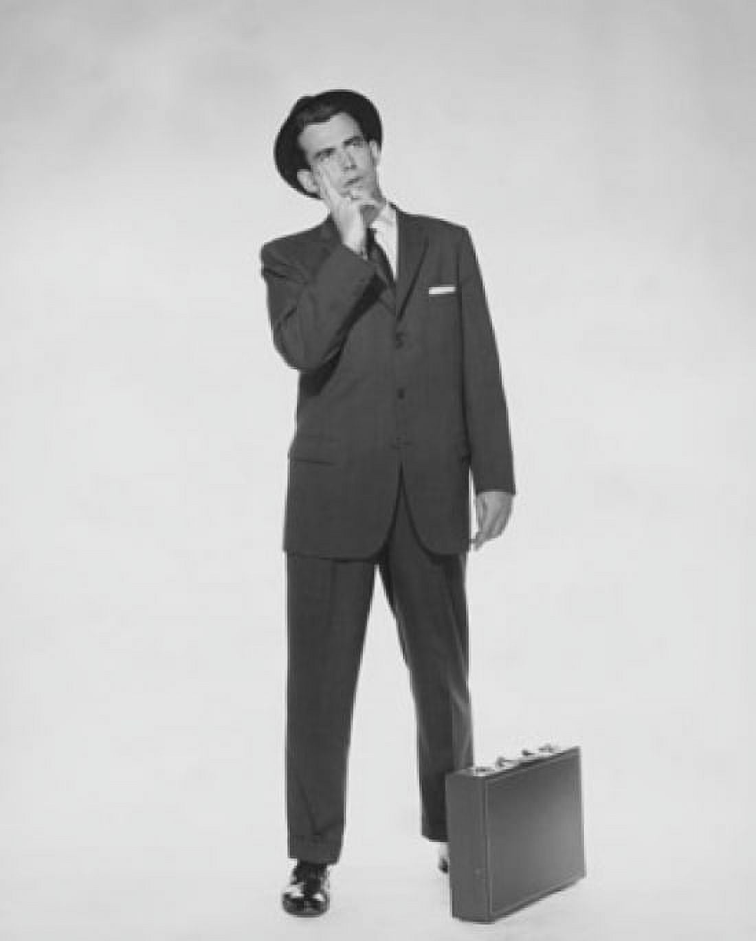 Businessman standing with a briefcase Canvas Art - (24 x 36)