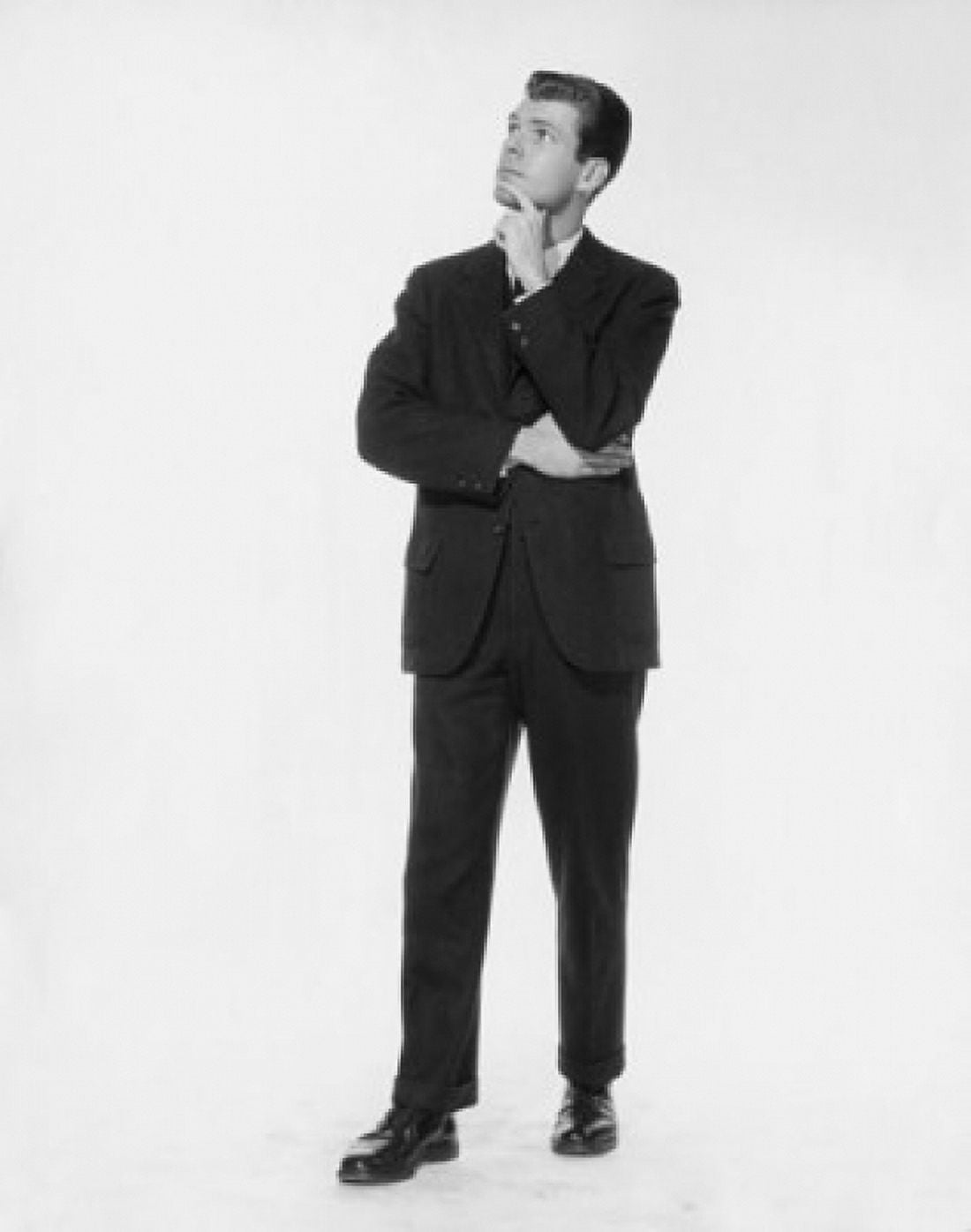 Businessman standing with his hand on his chin Canvas Art - (24 x 36)