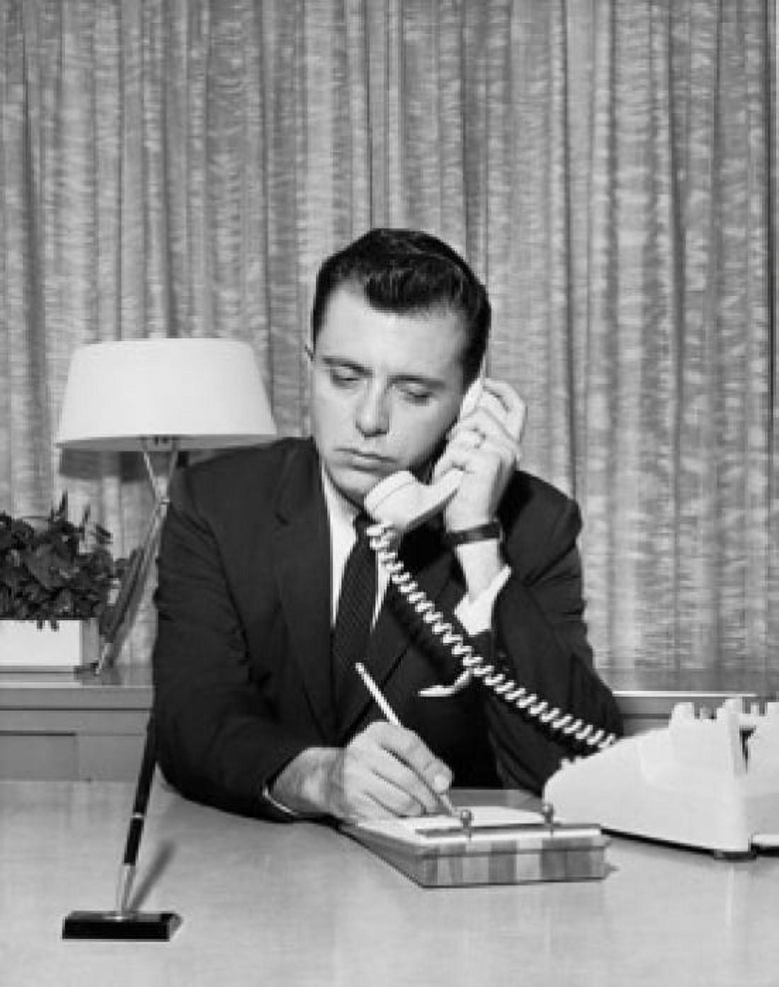 Businessman talking on telephone in office Canvas Art - (18 x 24)