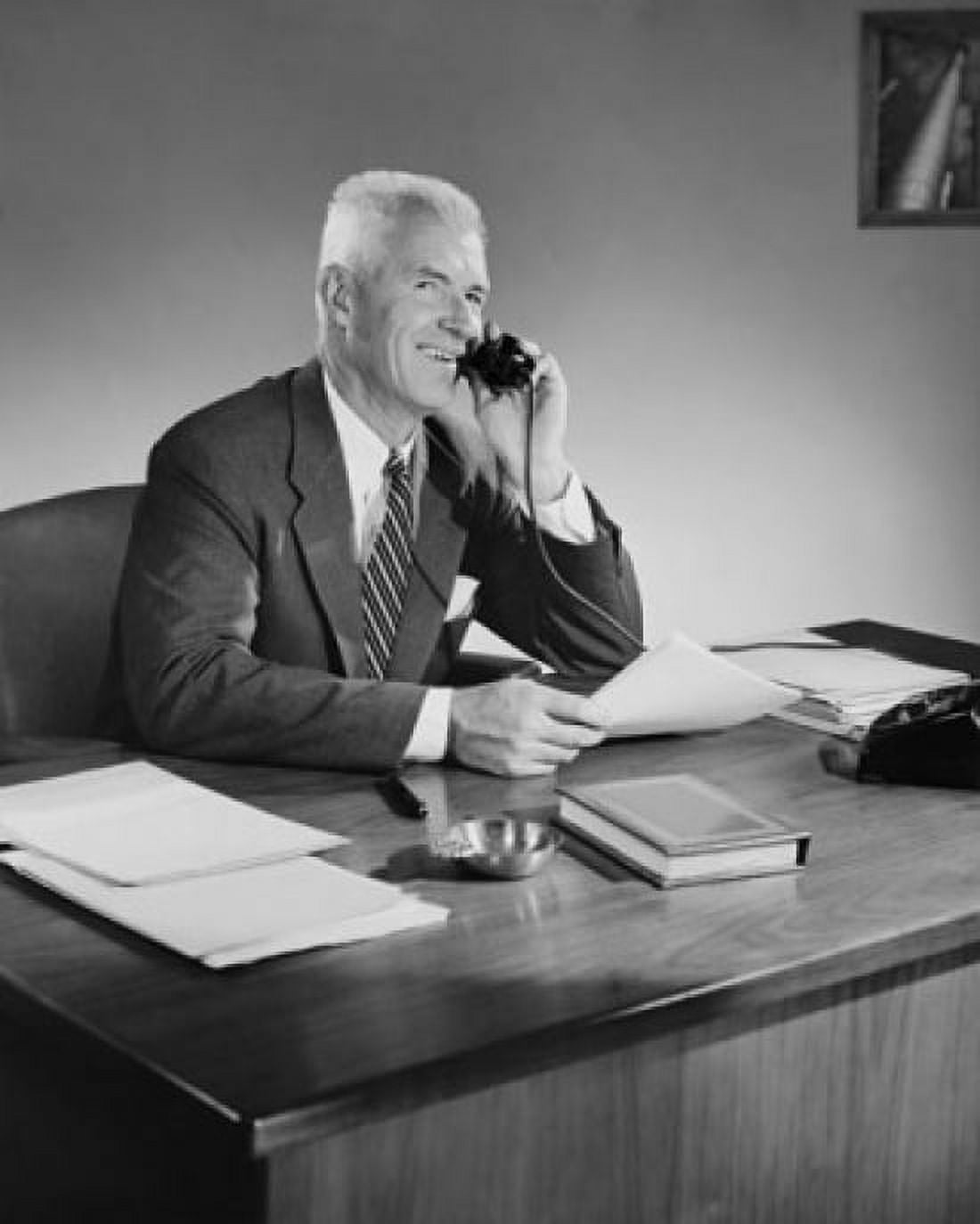 Businessman talking on telephone in office Canvas Art - (24 x 36)