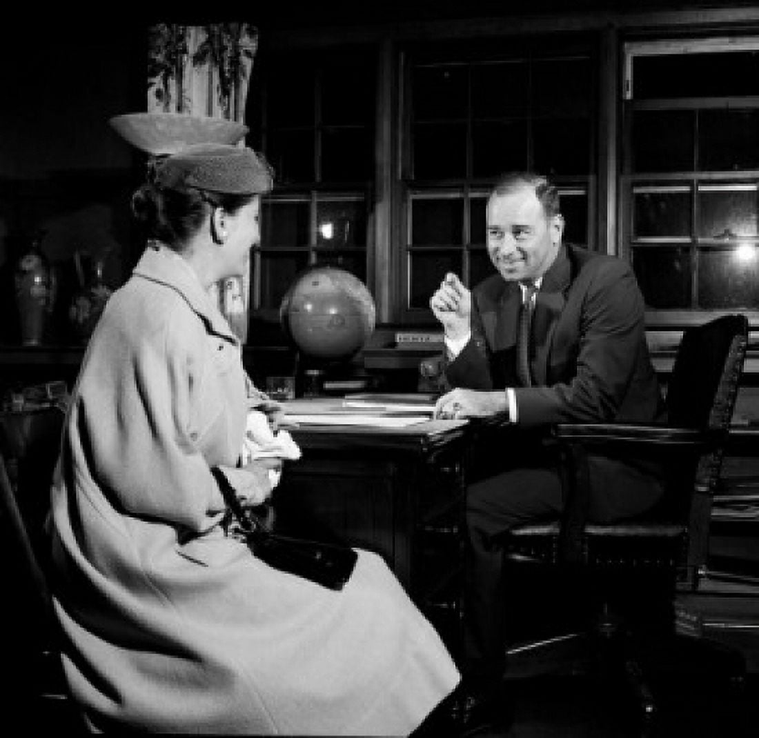 Businessman talking to woman in office Canvas Art - (18 x 24)