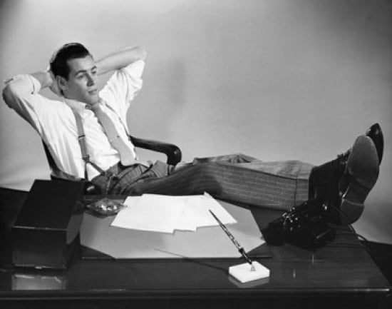 Businessman thinking with his legs resting on a desk Canvas Art - (18 x 24)