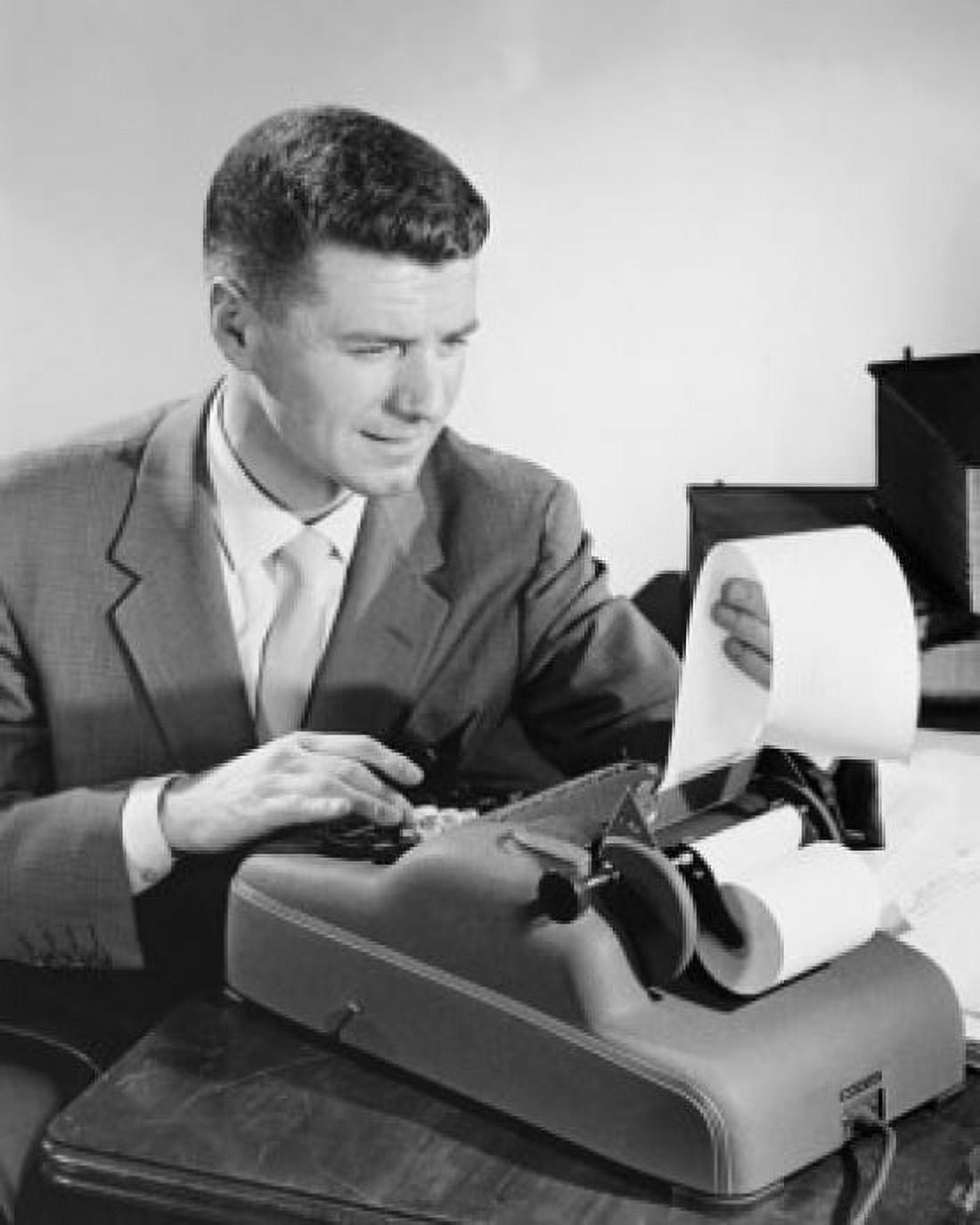 Businessman using an adding machine Canvas Art - (18 x 24)