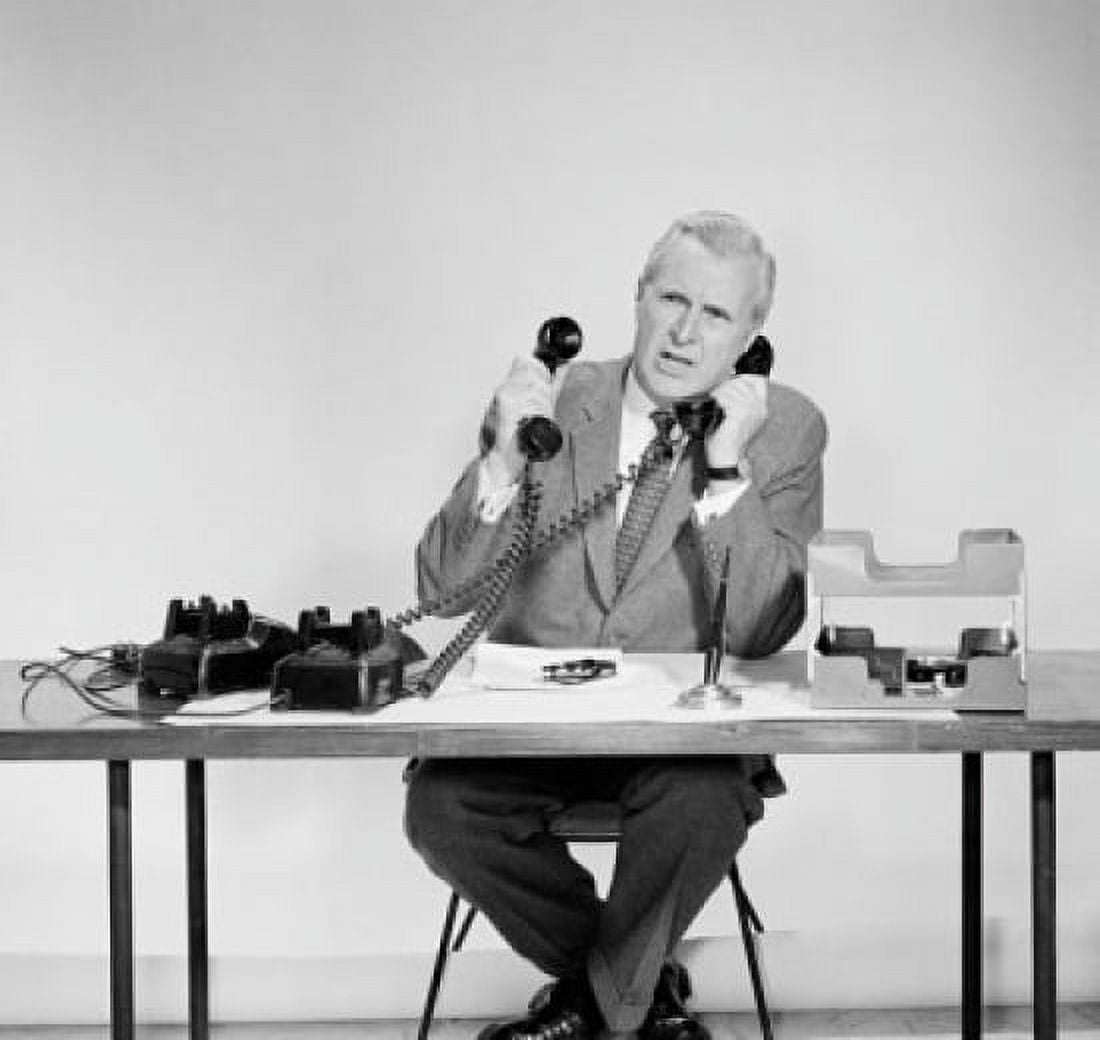 Businessman using two telephones Canvas Art - (18 x 24)