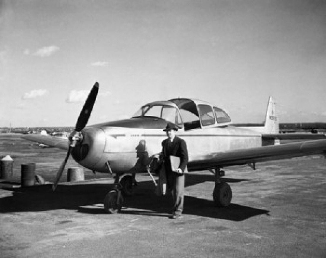 Businessman walking away from an airplane Canvas Art - (24 x 36)