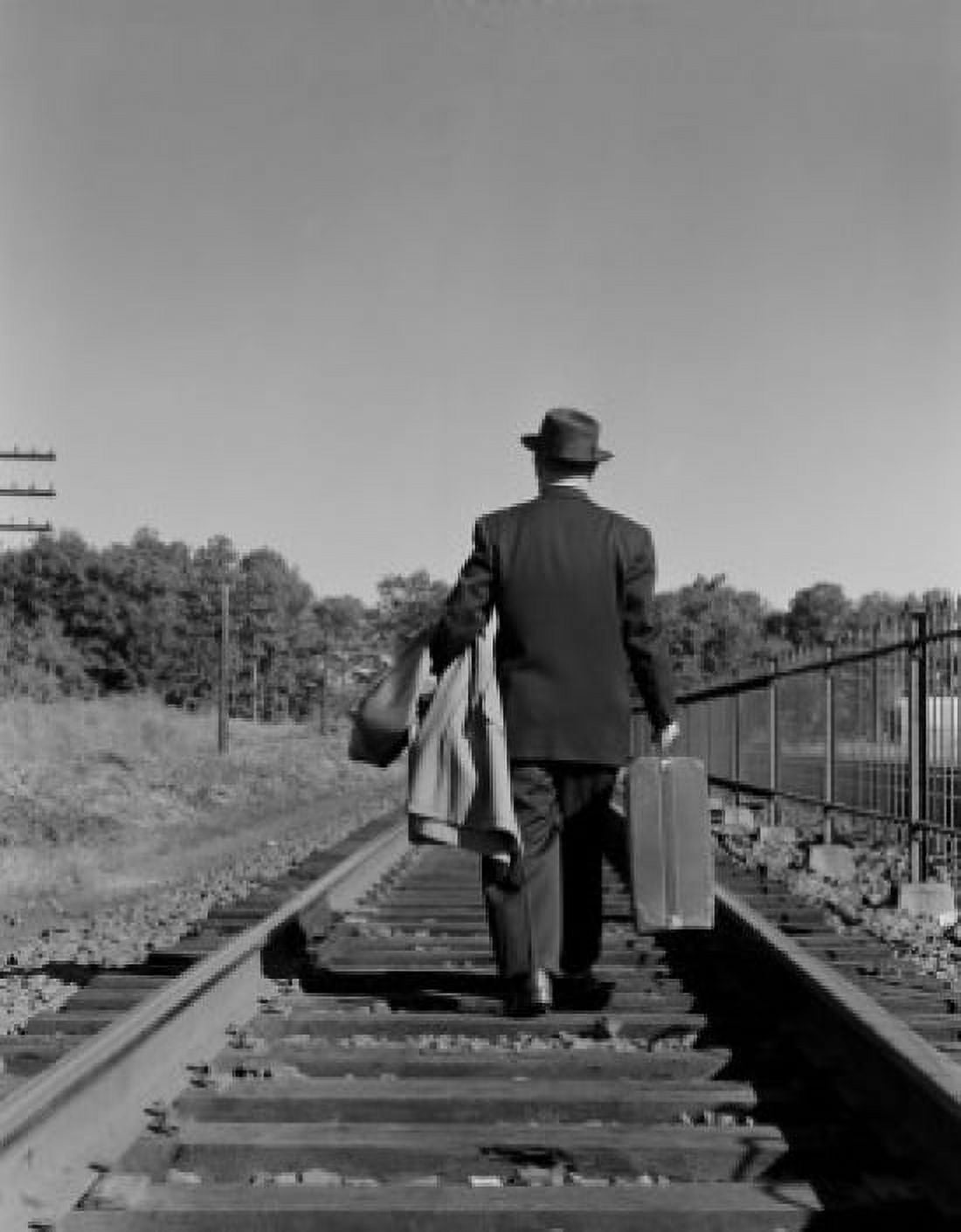 Businessman walking down railway tracks Canvas Art - (18 x 24)