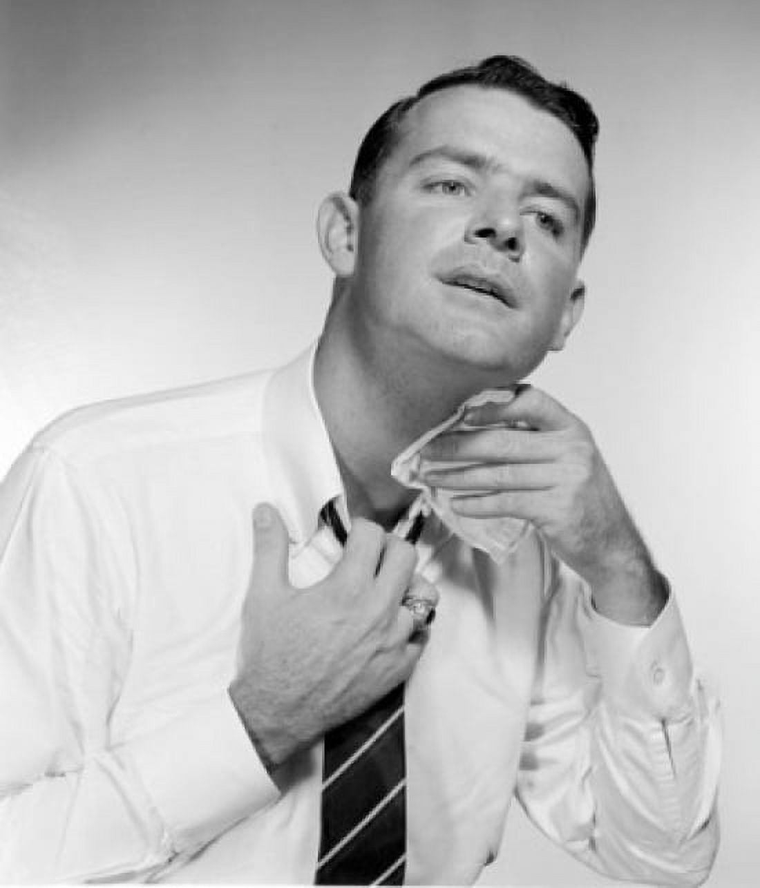 Businessman wiping neck studio shot Canvas Art - (24 x 36)