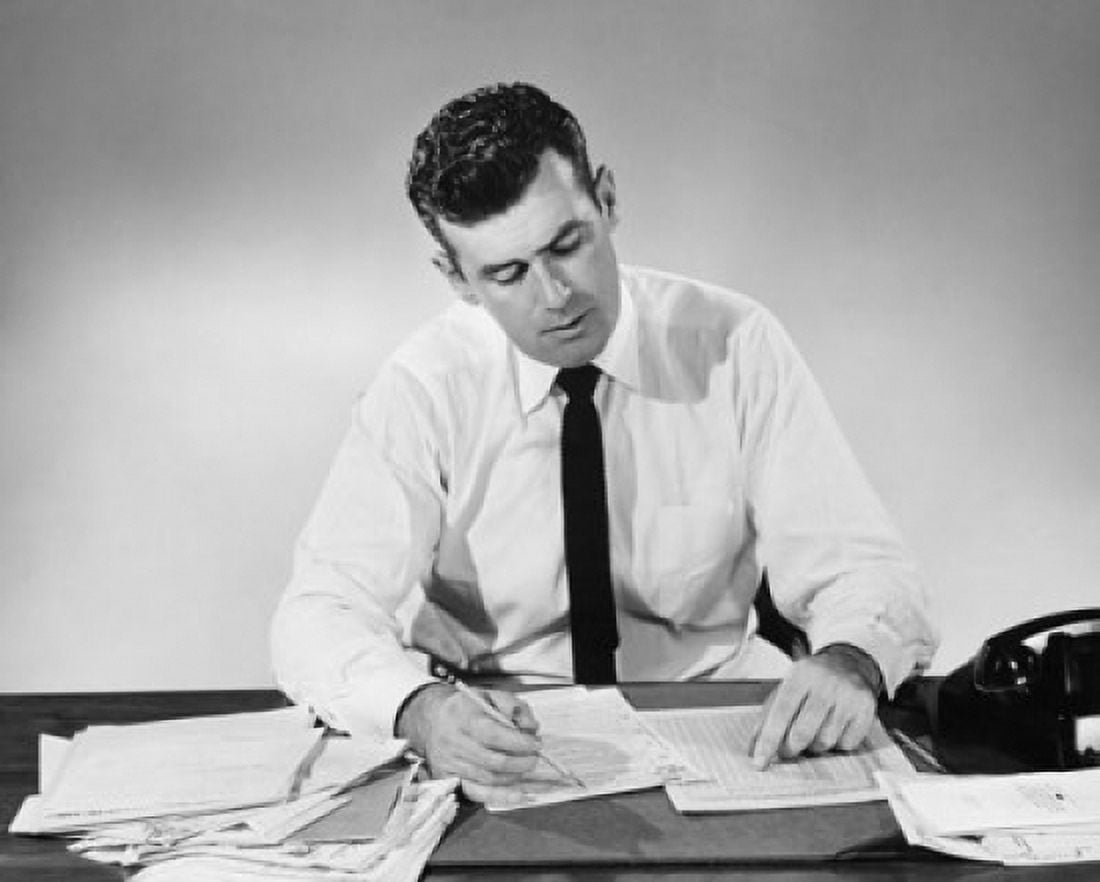 Businessman working in an office Canvas Art - (18 x 24)