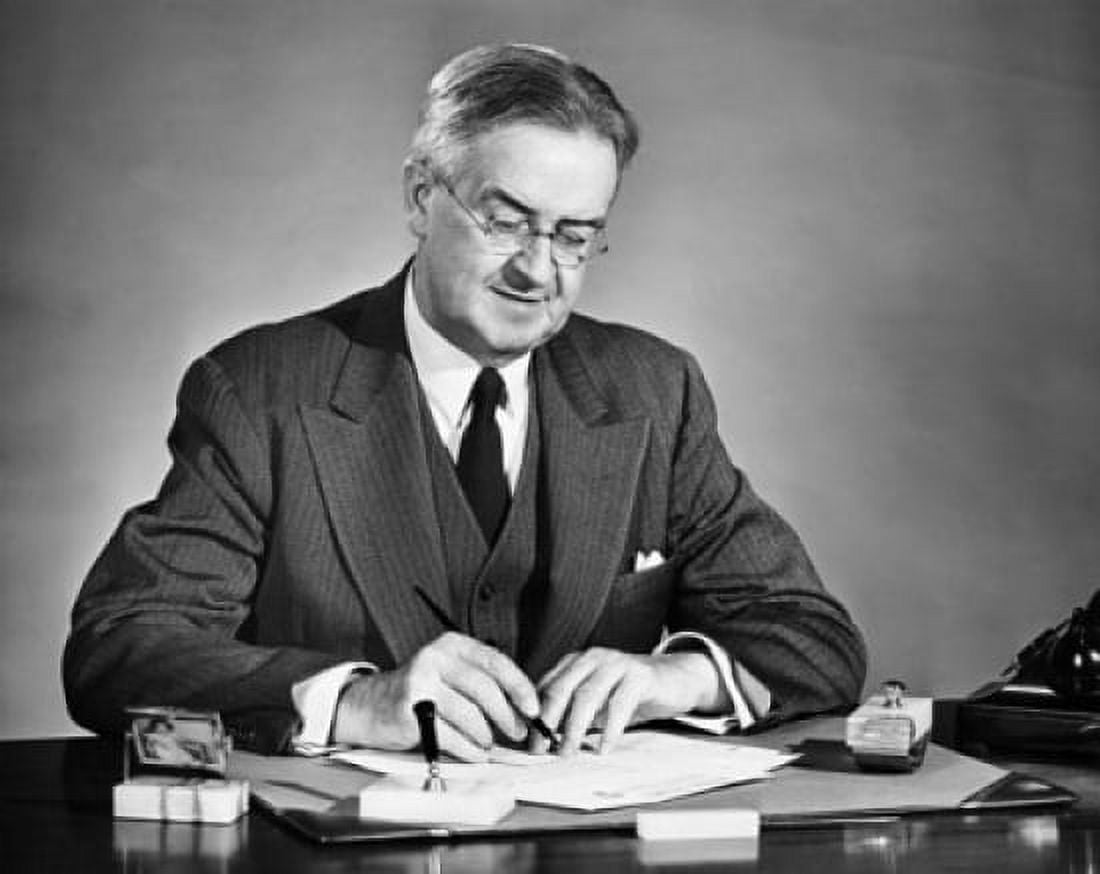Businessman writing on a sheet of paper and smiling Canvas Art - (18 x 24)